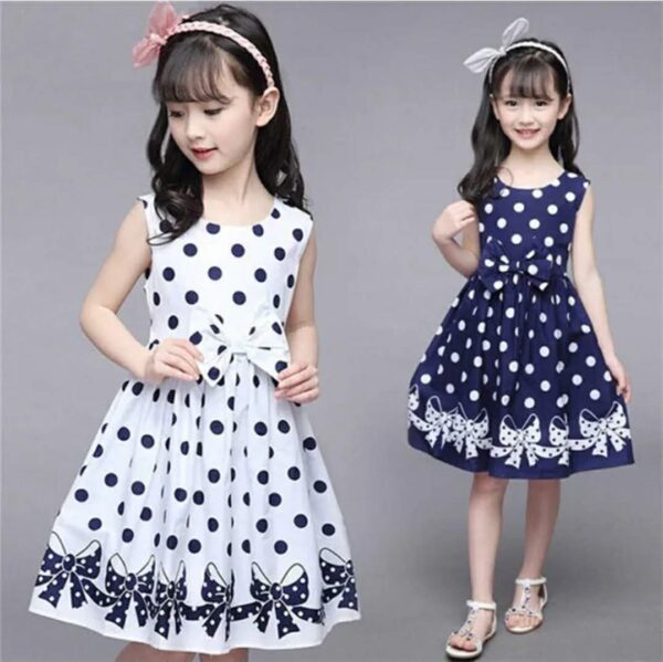 - Infant dresses - High quality polyester/cotton - White/Black -Polka dot pattern Sleeveless - Bow design